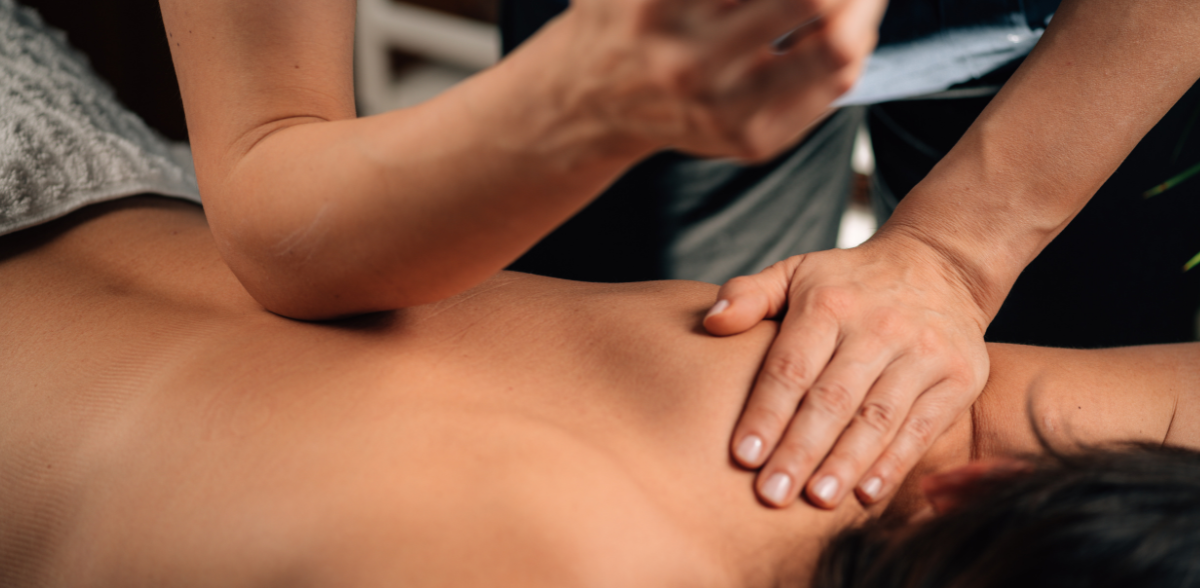 soft tissue therapy hero image Acupuncture needles being gently inserted into a patient’s upper back by a trained practitioner